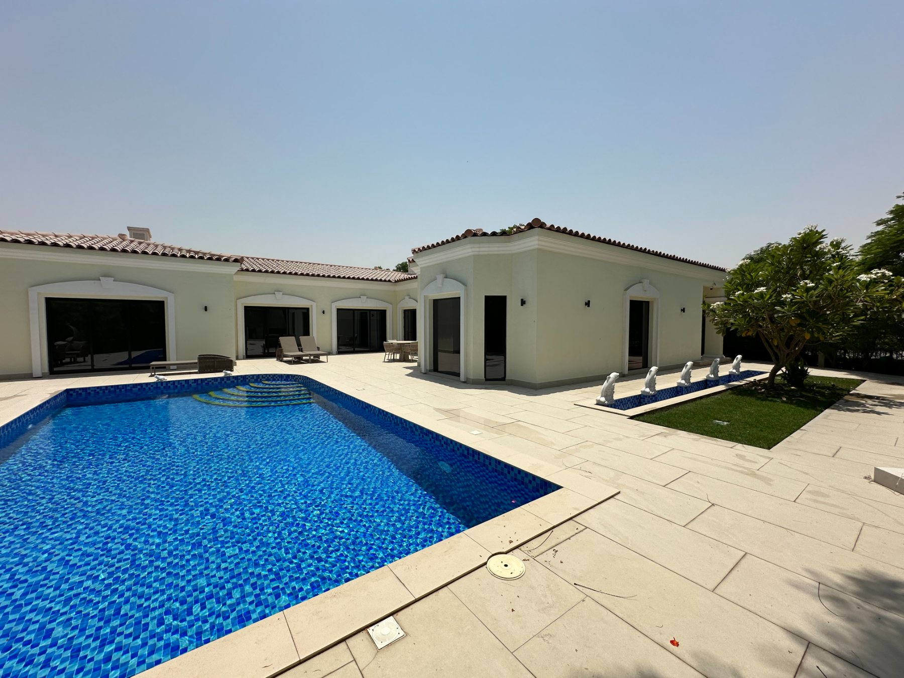 Green Community villa and pool by day